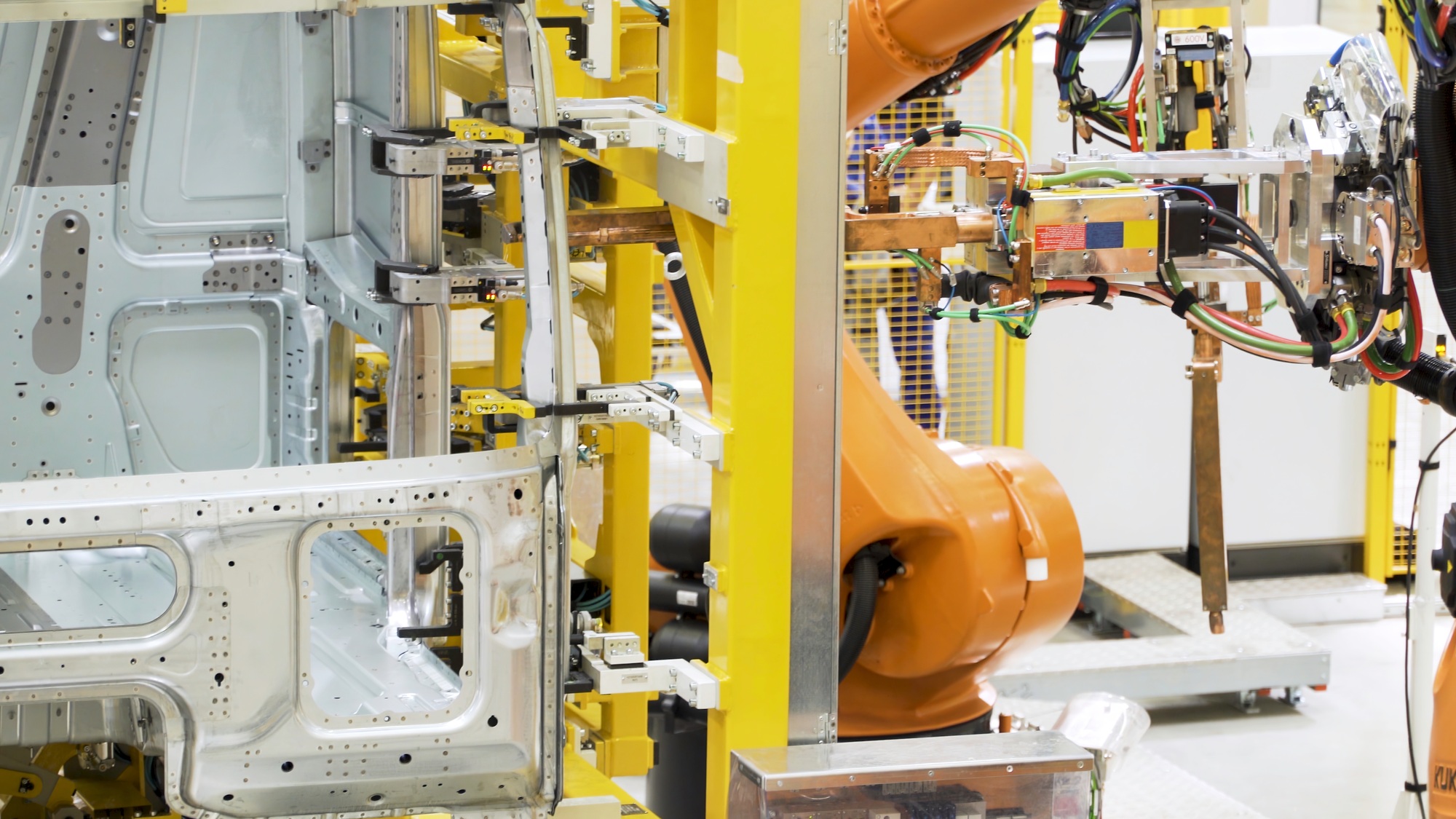 Robotic technology in production of machine parts. Scene. Robotic machines are working on creation